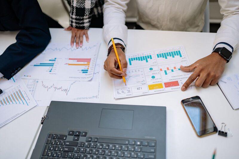 Marketing team reviewing sales analytics and performance charts