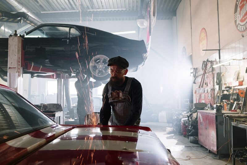 Automotive technician working on a vehicle in the shop