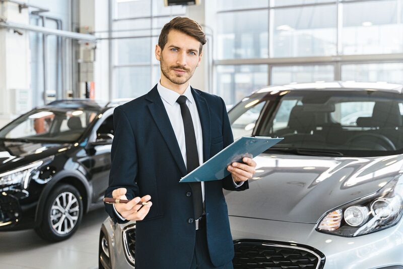 Row of vehicles on display at a car dealership